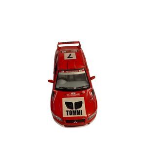 Sleek red racing toy car with detailed decals. Perfect for collectors or play.